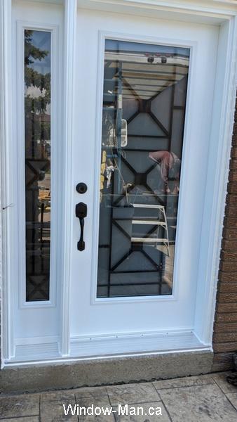 Front door. With one sidelight. Century modern glass insert